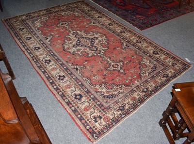 Lot 1099 - Ardabil rug, the terracotta field with central ivory medallion framed by spandrels and borders...