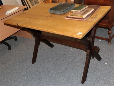 Lot 1113 - An X-Frame pine tavern table, 120cm wide by 78cm deep by 78cm high