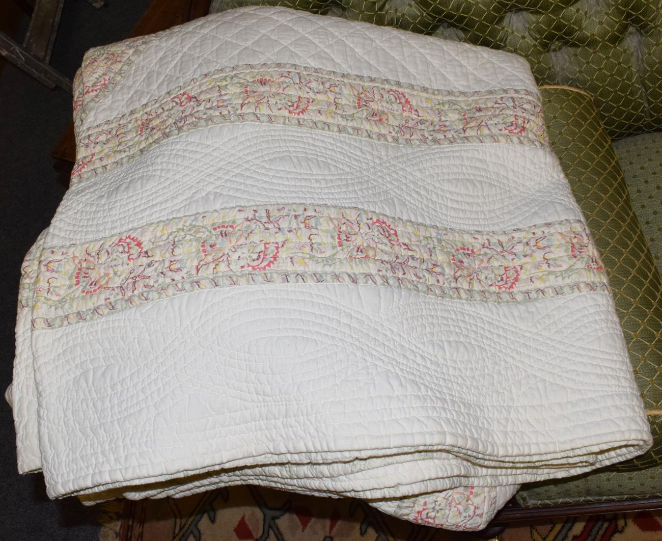 Lot 1120 - A large cotton patchwork quilt of recent date, the cream field with pink floral borders and central
