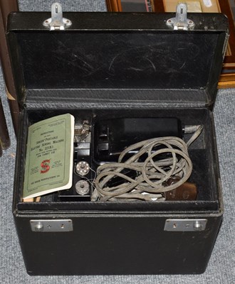 Lot 1132 - A Singer portable sewing machine No 221K1, together with accessories including the rubber mat...