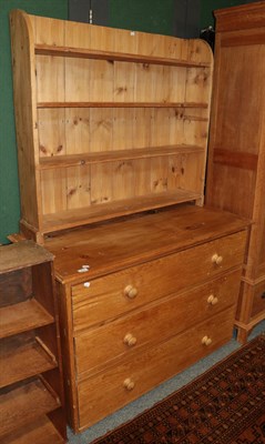 Lot 1179 - A pine three-drawer chest and a pine bookcase with four fixed shelves