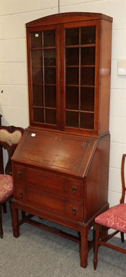 Lot 1194 - An oak bureau bookcase