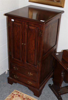 Lot 1204 - A reproduction oak linen fold bureau and a reproduction oak audio cabinet (2)