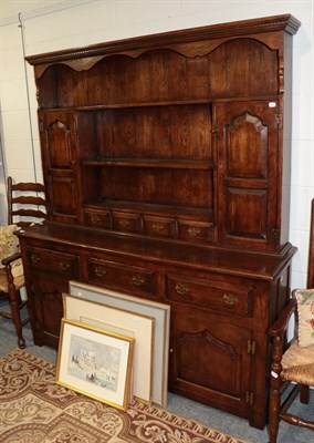 Lot 1206 - A Titchmarsh & Goodwin style oak dresser and rack, 167cm wide by 43cm deep by 192cm high