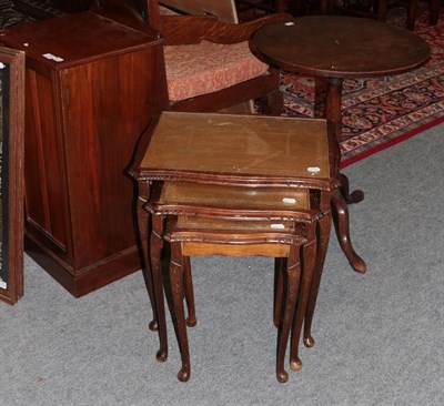Lot 1226 - A nest of tables; a mahogany tripod table; and a bedside cabinet (3)