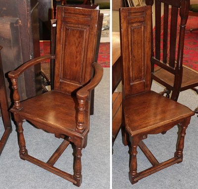 Lot 1240 - An oak panel back armchair modern and a similar single hall chair