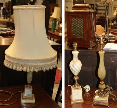 Lot 1247 - Three decorative lamps comprising a green onyx example with metal mounts, an alabaster urn...