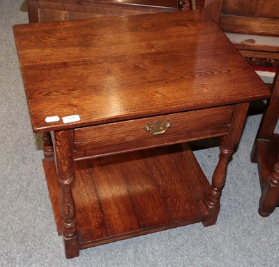 Lot 1249 - A Titchmarsh & Goodwin style oak lamp table fitted with a drawer, 61cm wide by 46cm deep by...