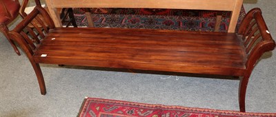 Lot 1258 - A reproduction hard wood double bench