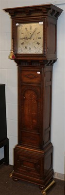 Lot 1276 - An Edwardian oak carved eight-day long case clock, silver dial signed Maple. London, double...