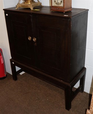 Lot 1277 - An 18th century oak fitted cabinet by stand