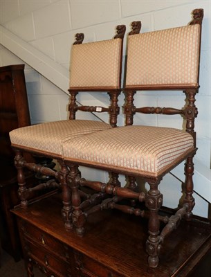 Lot 1281 - A pair of Gothic hall chairs with lion terminals