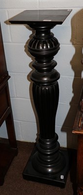 Lot 1282 - An ebonised plant pedestal