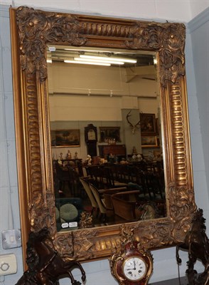 Lot 1284 - A reproduction gilt framed bevelled glass mirror