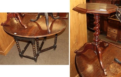 Lot 1293 - A early 20th century oak barley twist dining table and a carved mahogany tripod table