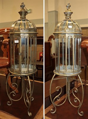 Lot 1310 - A pair of reproduction lanterns on stands