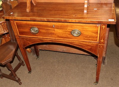 Lot 1315 - A George III mahogany side table, the single drawer raised on castors, 98cm wide by 35cm deep...