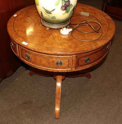 Lot 1316 - A walnut drum table on tripod base