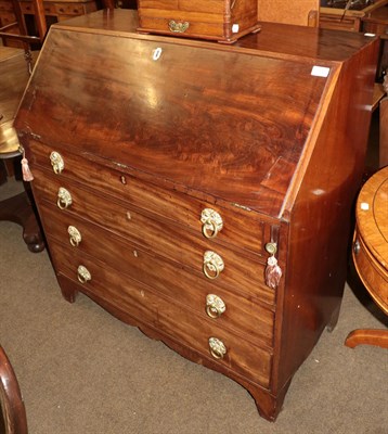 Lot 1318 - A George III mahogany bureau with fitted interior