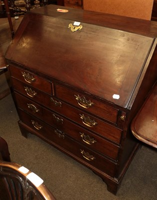 Lot 1319 - A George III mahogany bureau, fall flap, fitted interior, two short over three long graduated...