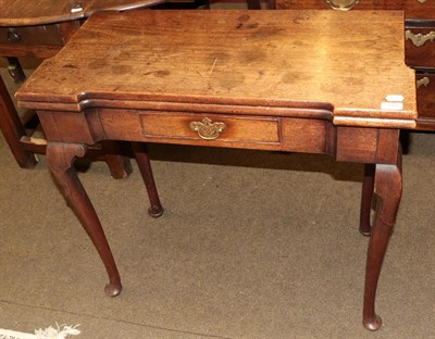 Lot 1322 - A George III mahogany fold over tea table