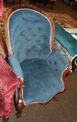 Lot 1328 - A Victorian carved walnut armchair, upholstered in blue velvet