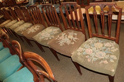 Lot 1335 - A set of eight late 19th/early 20th century carved mahogany dining chairs on fluted legs