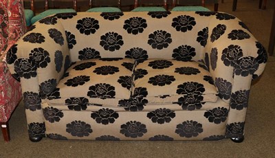 Lot 1337 - A Victorian Chesterfield settee, re-upholstered in black floral fabric