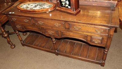 Lot 1362 - A reproduction oak dresser base, 155cm wide by 37cm long by 76cm high