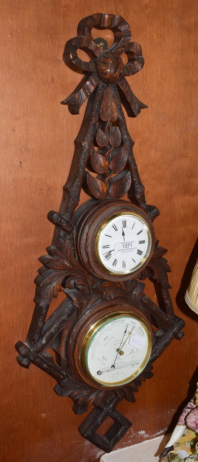 Lot 1371 - A late Victorian carved wood aneroid/thermometer combined timepiece, retailed by Cain, Halifax