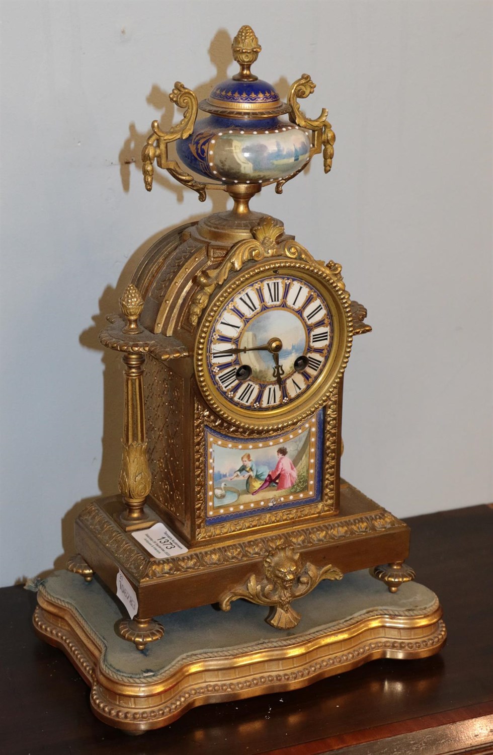 Lot 1373 - A French late 19th century gilt metal porcelain mounted striking mantel clock, twin barrel...