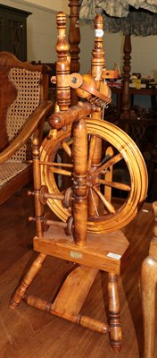 Lot 1378 - A turned spinning wheel labelled Keith Judy, Hadfield