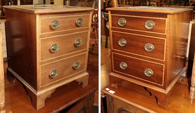 Lot 1379 - A pair of small three-drawer faux chests