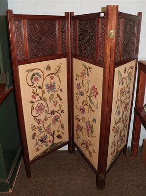 Lot 1396 - Carved Arts & Crafts three fold screen with embroidered fabric panels, signed Alice Foster, Jan...