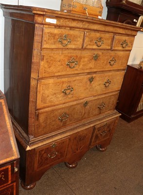 Lot 1409 - An early Georgian burr walnut chest on associated stand