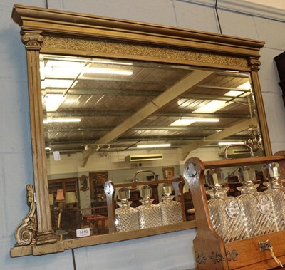 Lot 1410 - A late 19th century gilt over mantle mirror with bevel glass plate