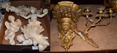 Lot 1413 - An early 20th century gilt wood wall bracket with cherubs, 41cm high, together with a a gilt...