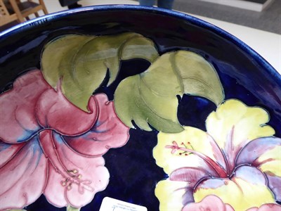 Lot 2 - Walter Moorcroft (1917-2002): An Orchid and Spring Flowers Bowl, on a blue ground, impressed...