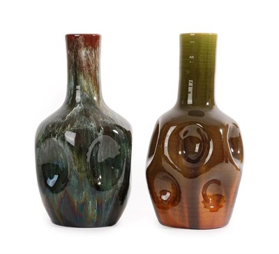 Lot 7 - Two Linthorpe Pottery Dimpled Bottle Vases, shape 24, in mustard and green glaze and green and...
