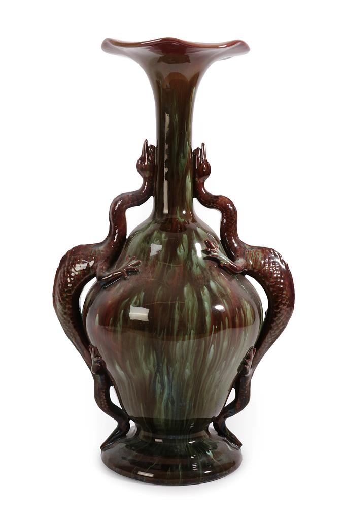 Lot 24 - A Palissy Pottery Co. Ltd Twin-Handled Vase, the handles modelled as dragons, glazed in brown...