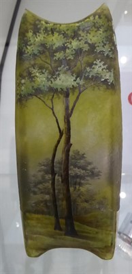 Lot 36 - A Daum Nancy Enamelled Cameo Landscape Vase, decorated with a continuous scene of trees, signed...