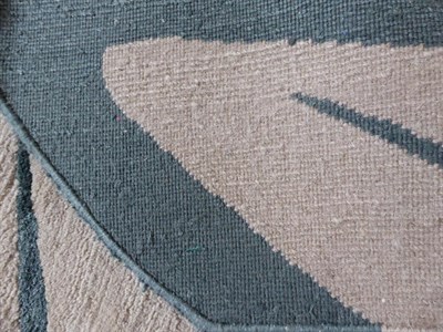 Lot 51 - Deirdre Dyson: An Abstract Oak Leaf Rug, hand knotted wool, in oatmeal, dark green and sage,...
