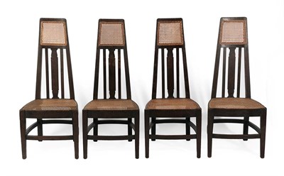 Lot 173 - Four William Birch (High Wycombe) Arts & Crafts Tall Stained Oak Dining Chairs, the uprights...