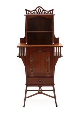 Lot 175 - An Art Nouveau Mahogany Music Cabinet, the upper section with pierced fret cut cornice above an...