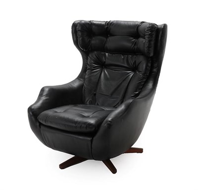 Lot 185 - A Parker Knoll Statesman Egg Chair, with swivel and tilt mechanism, black vinyl upholstery with...