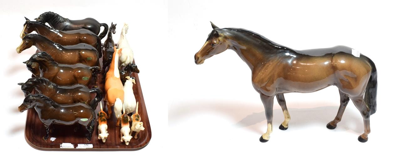 Lot 16 - Beswick horses including: Exmoor pony, Horse (head and leg tucked), stocky jogging mare, large...