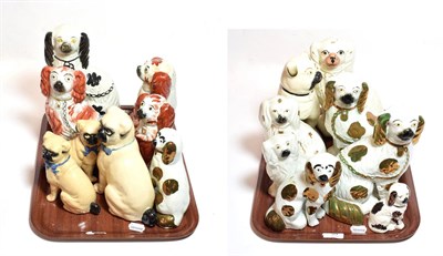 Lot 34 - Two trays of 19th century Staffordshire seated spaniels and pugs