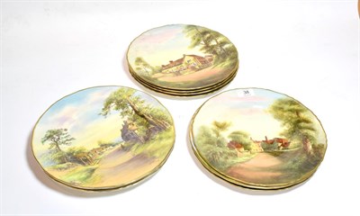Lot 38 - A set of eleven Royal Worcester cabinet plates, each painted and signed, depicting scenes from...