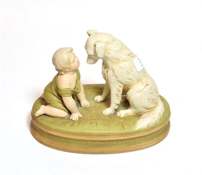 Lot 39 - A Royal Dux model of a child and dog, model no. 2369, 18cm high