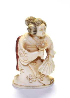 Lot 49 - A Meiji period ivory netsuke in the form of a Geisha
